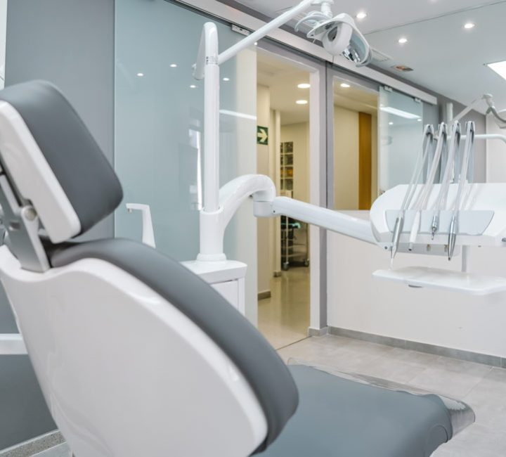 a dental clinic with a dental chair and dental equipment